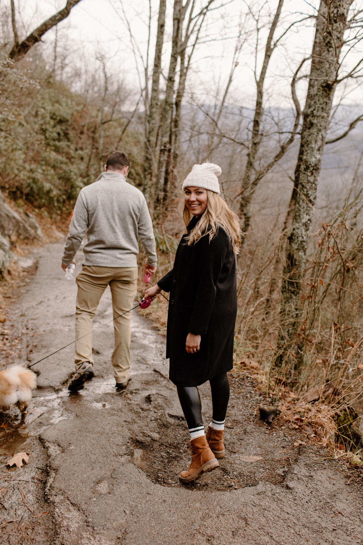 Couples portraits while hiking down the mountain after getting engaged in front of the waterfall at Laurel Falls in the Smoky Mountains.