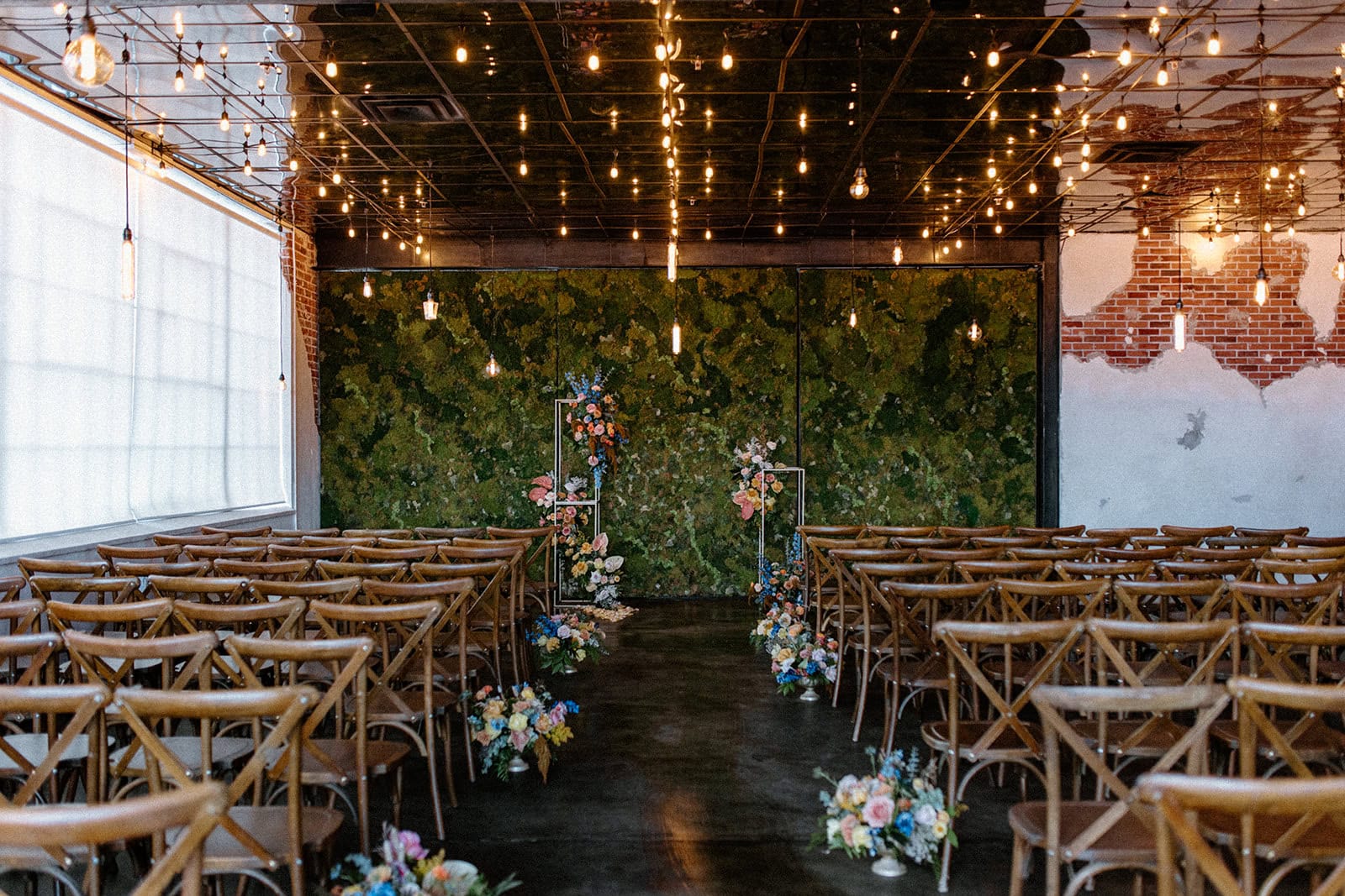 Moss Denver is one of the best Colorado wedding venues. The inside is a blank canvas and the ceremony space is unique for each couple with a moss wall backdrop.