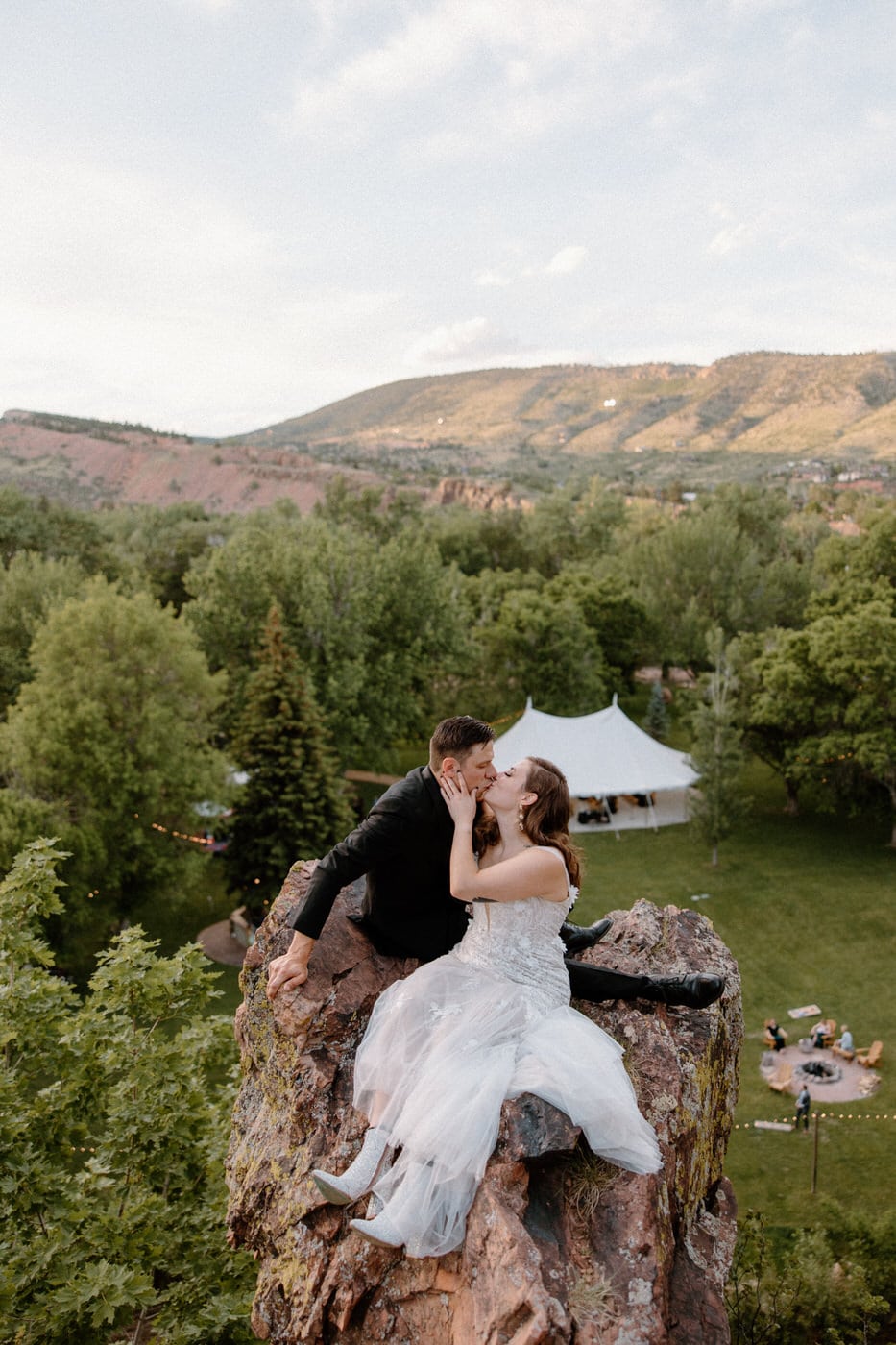 River Bend Wedding Venue in Colorad. This is one of the best Colorado wedding venues and the cliffside sunset photos with the bride and groom.