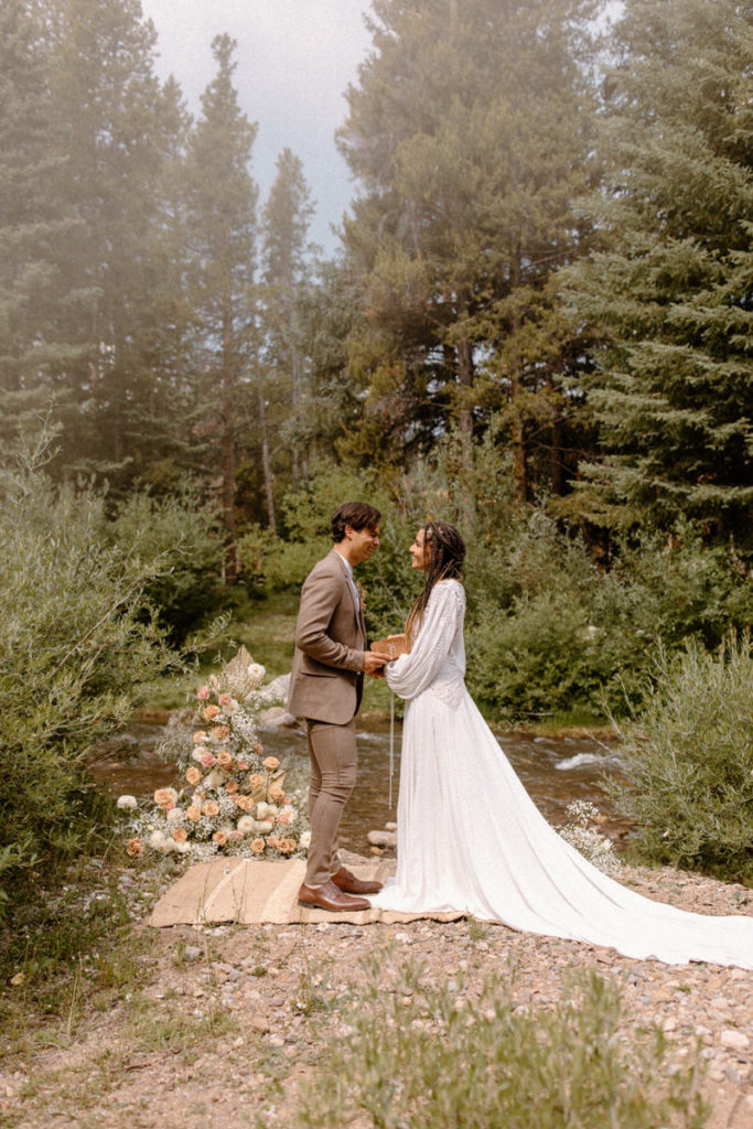 Husband and wife sharing vows in Breckenridge, Colorado during their elopement. 