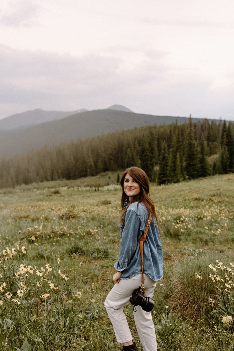 Colorado elopement photographer in wildflowers in the mountains of Breckenridge
