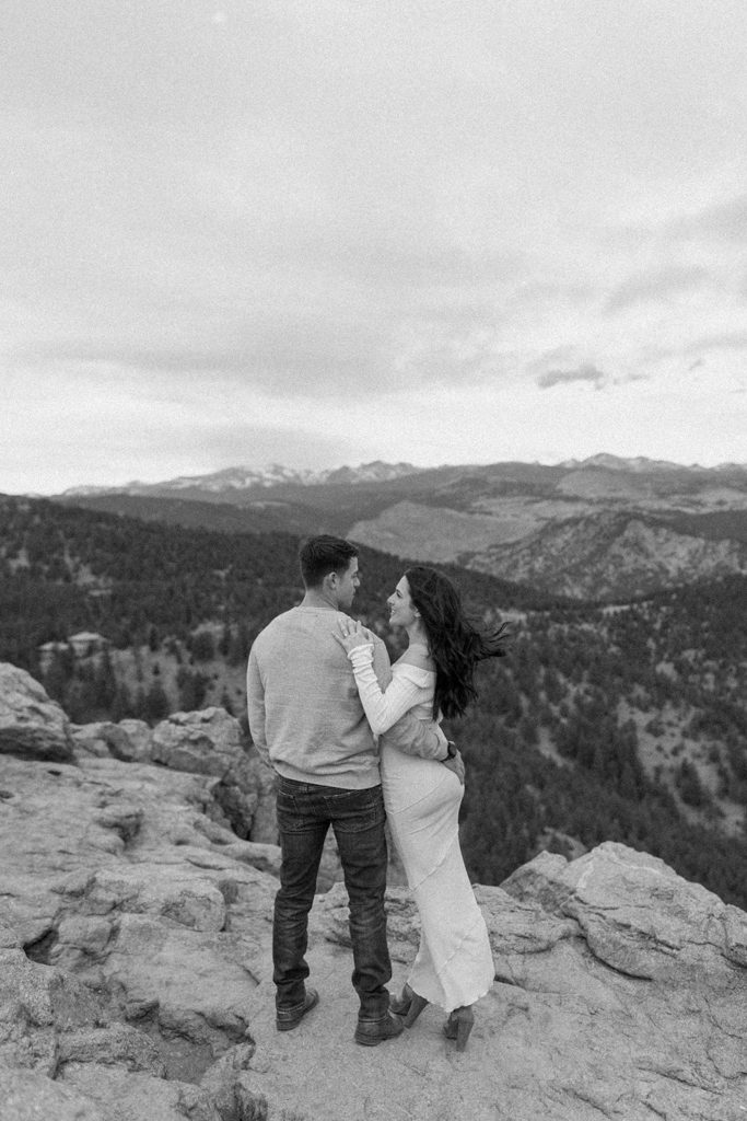man and woman embracing at their Lost Gulch Overlook Sunrise Engagement Session