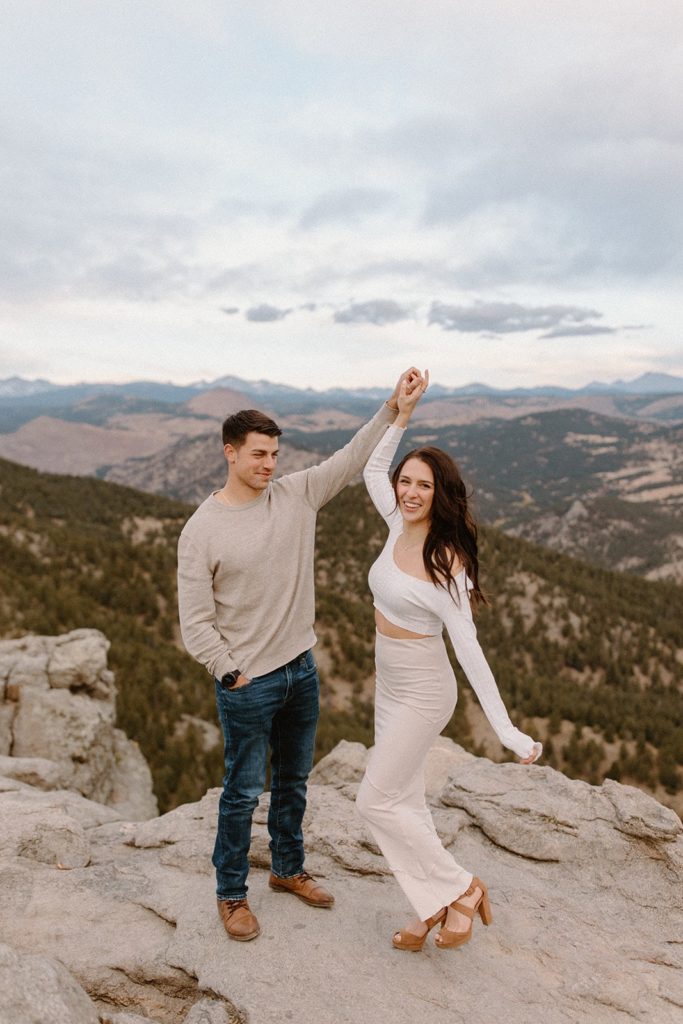 man and woman dancing at their Lost Gulch Overlook Sunrise Engagement Session
