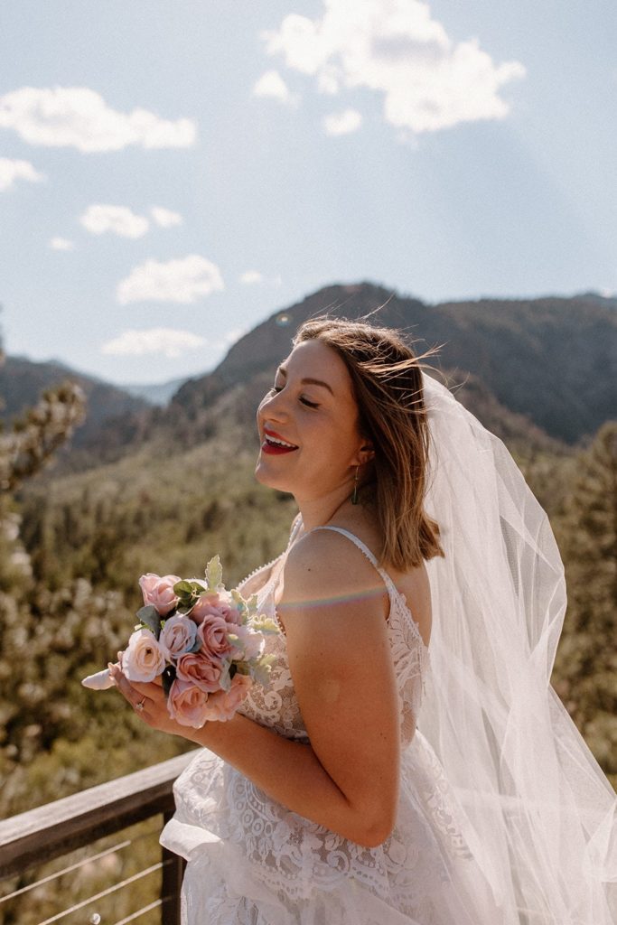 woman enjoying the sun and outdoors and happy on her Garden of the Gods Elopement day