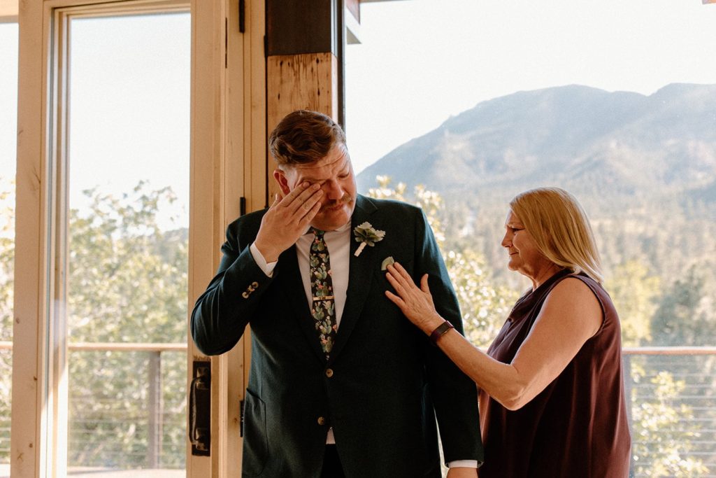 man getting emotional with his mom on his Garden of the Gods Elopement day