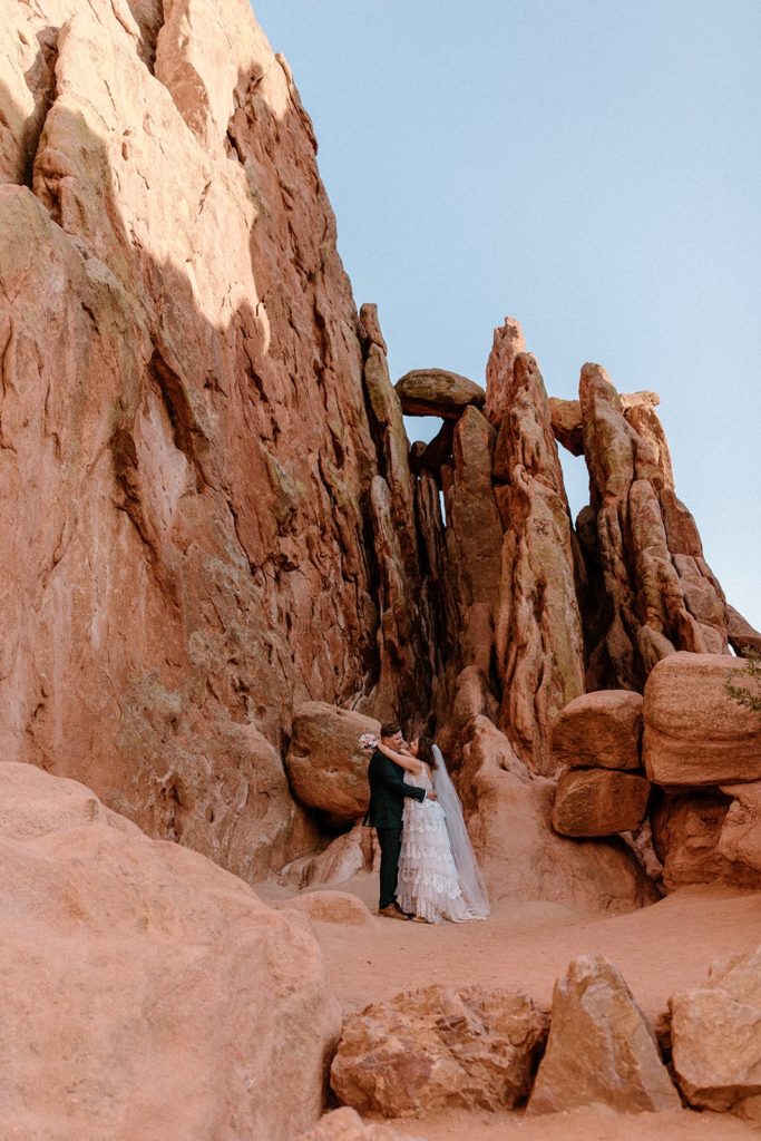 man and woman hugging on their Garden of the Gods Elopement day