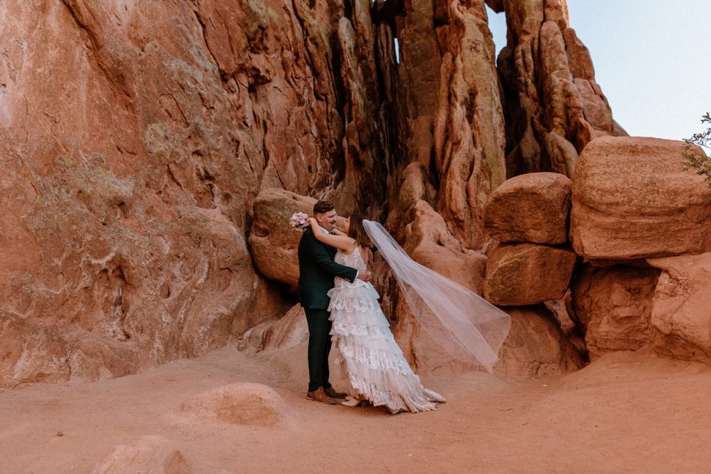 man and woman hugging on their Garden of the Gods Elopement day