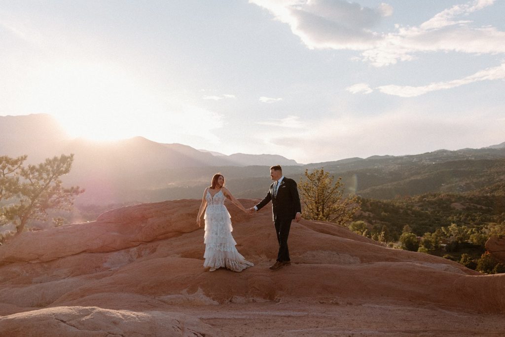 woman leading man on a walk for their Garden of the Gods Elopement 