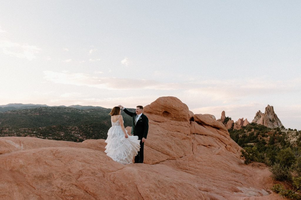 man and woman dancing for their Garden of the Gods Elopement 