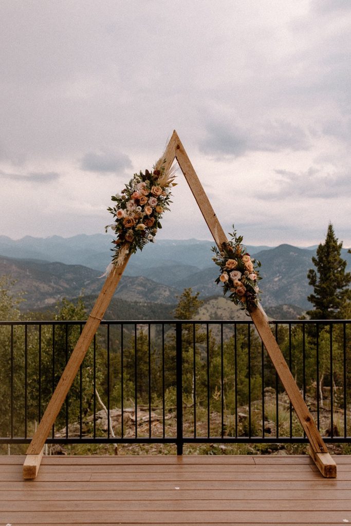 gorgeous floral ceremony arch for a North Star Gatherings Wedding
