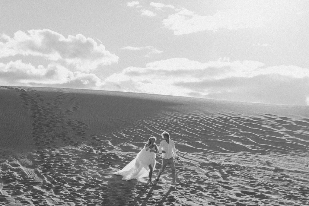 man and woman running in Great Sand Dunes National Park
