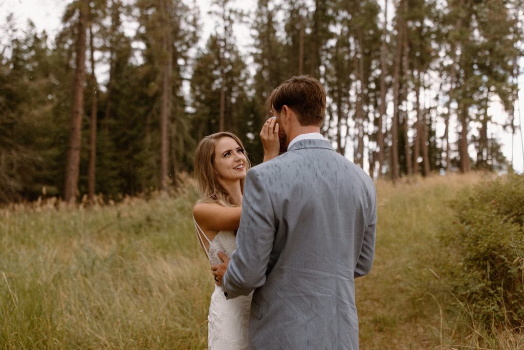 bride and groom happy after their first look for their Montana Elopement
