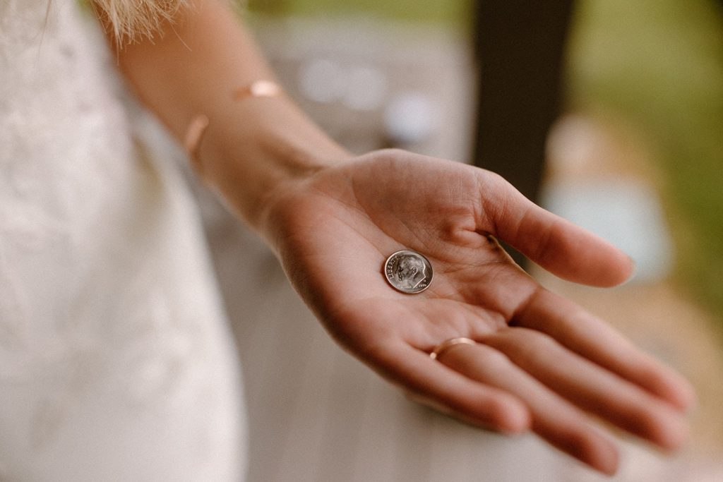 the dime we found on this bride and groom happy after their first look for their Montana Elopement day
