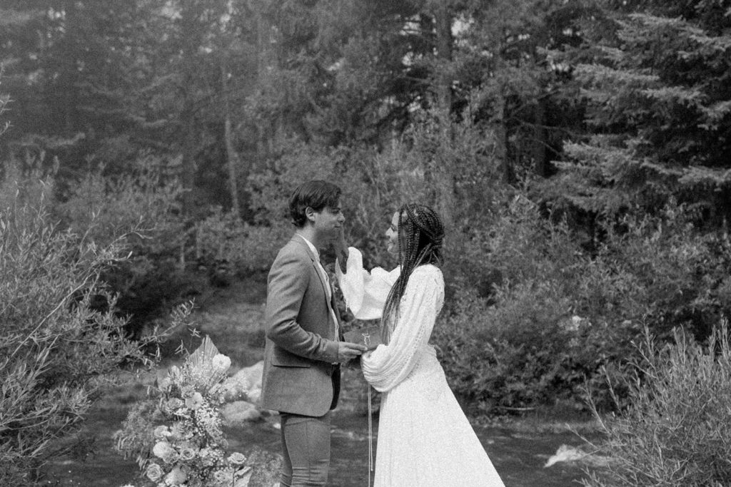 man and woman exchanging vows for their Colorado elopement