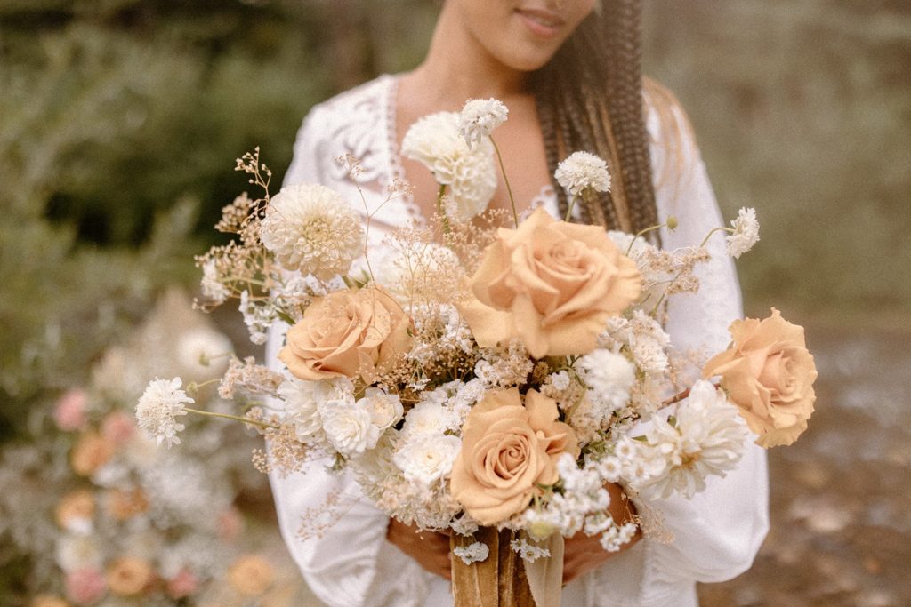 woman holding her wedding bouquet on her Colorado elopement day