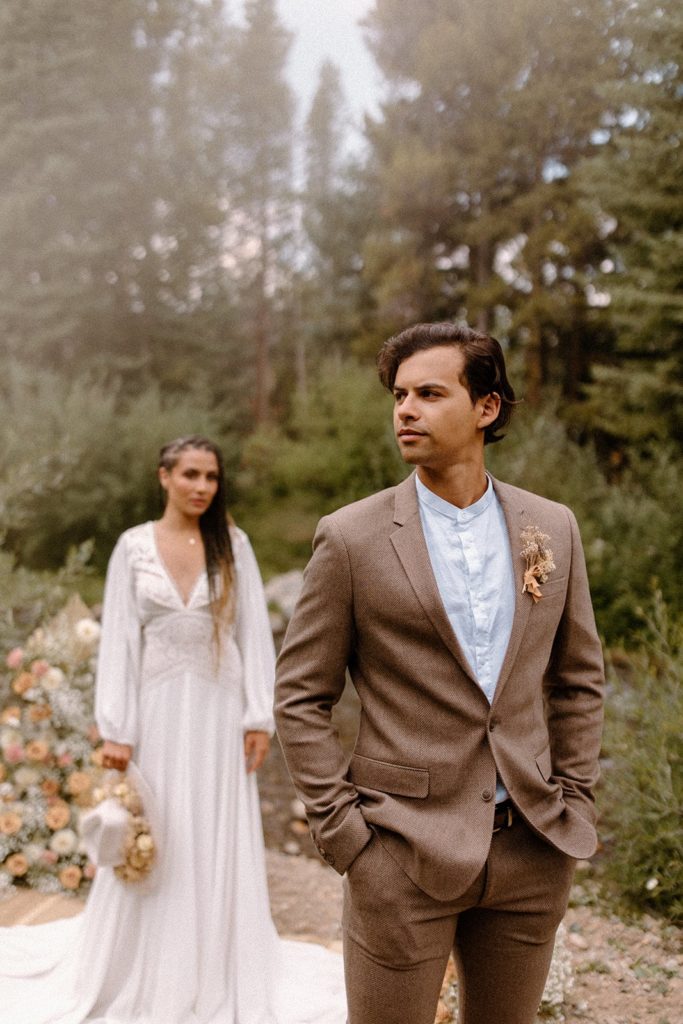 woman gazing at her fiance while he stares into the distance on their Colorado elopement day