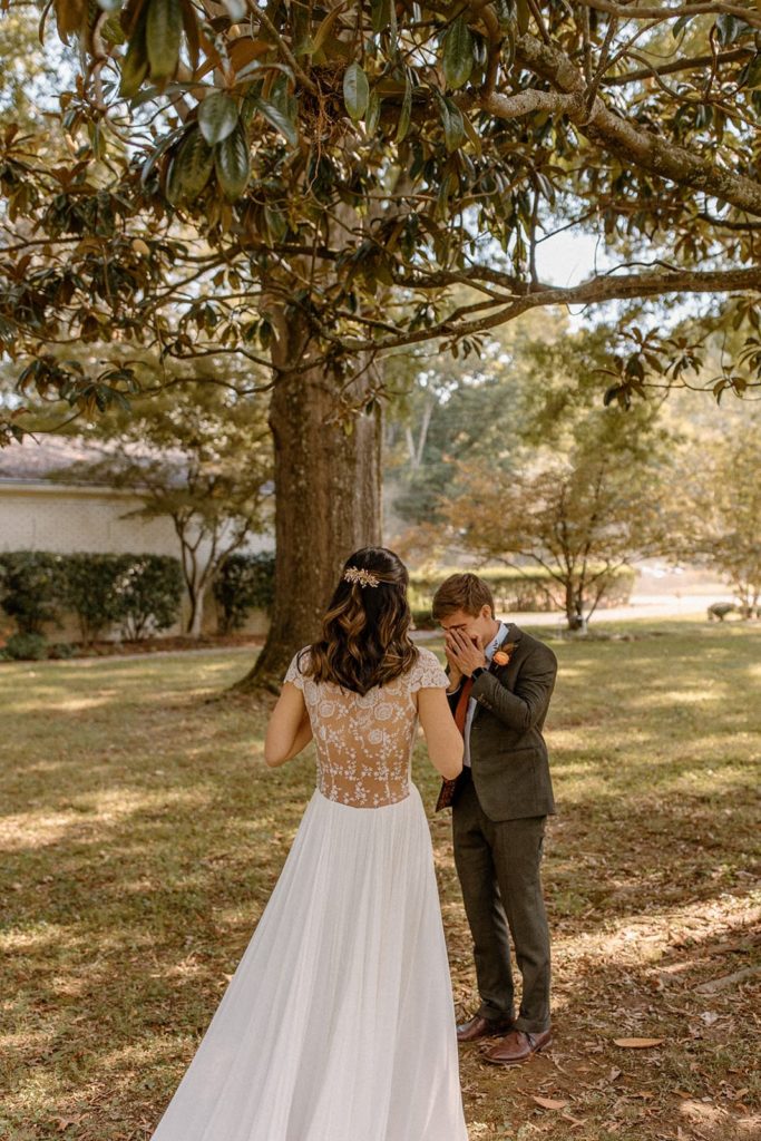 Emotional first look during a backyard wedding in Nashville, TN.