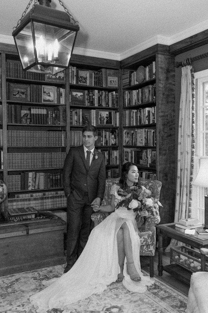 Wedding portraits of the bride and groom in a library room for a backyard wedding.