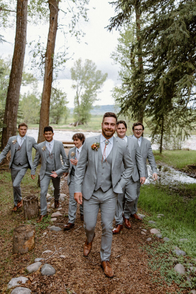 groomsmen photos in the woods